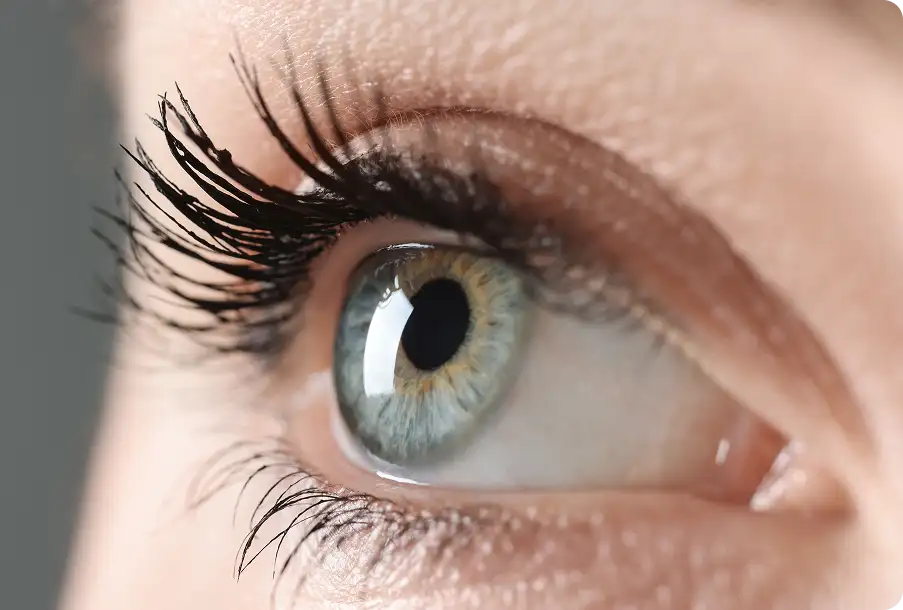 A closeup of a woman’s eye during an eye exam.
